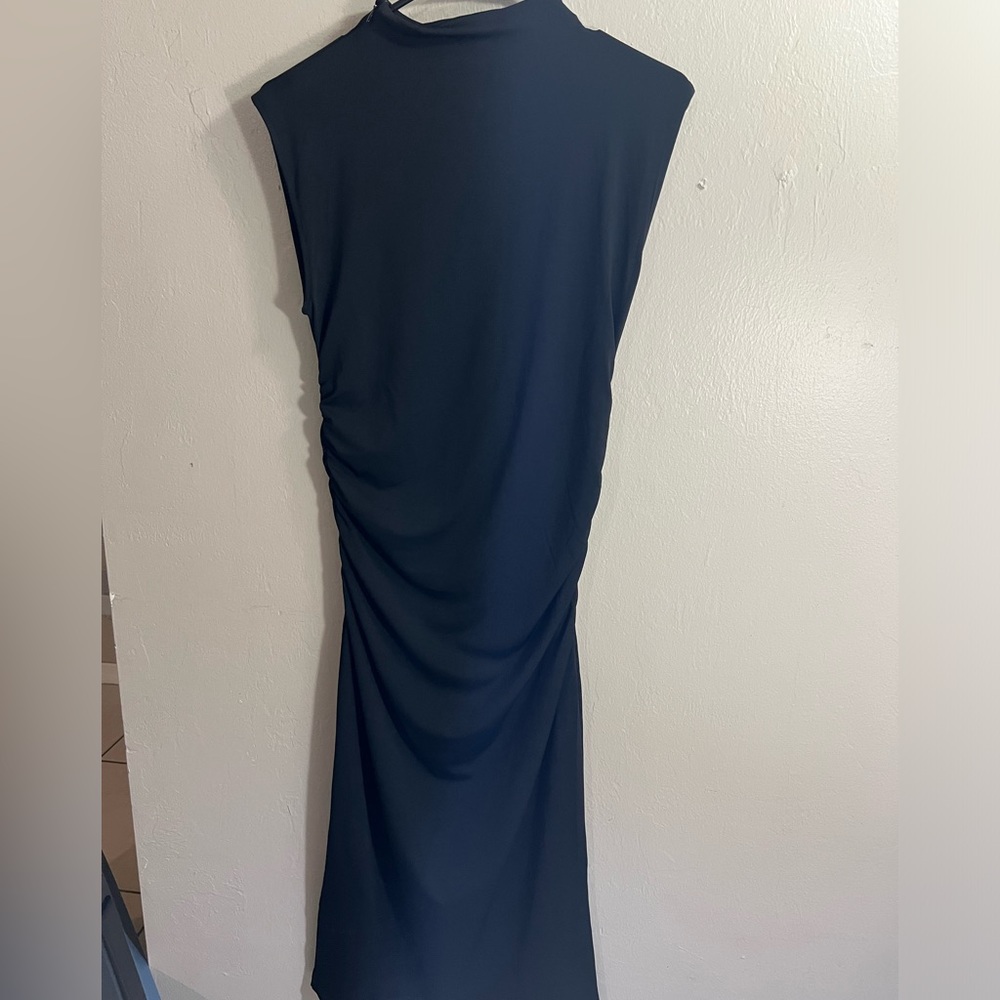 Black sleeveless dress.